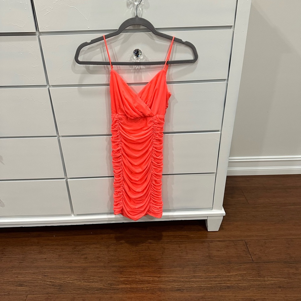 Lucy in the Sky size XS. Color Coral.